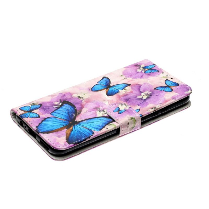 Leren Hoesje voor Huawei Y6p Blauwe Vlinders In De Bloemen