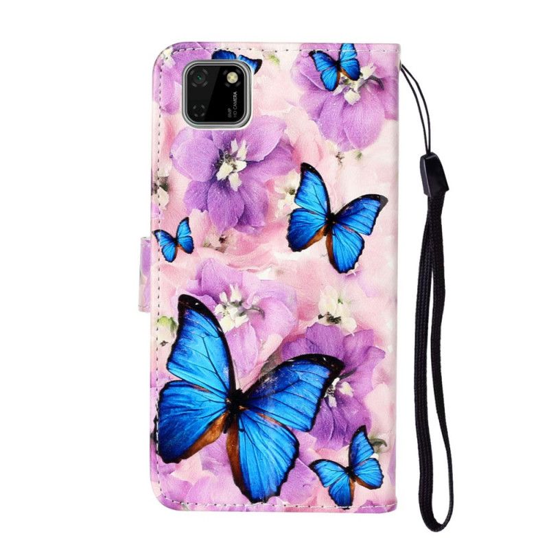 Leren Hoesje voor Huawei Y5p Blauwe Vlinders In De Bloemen