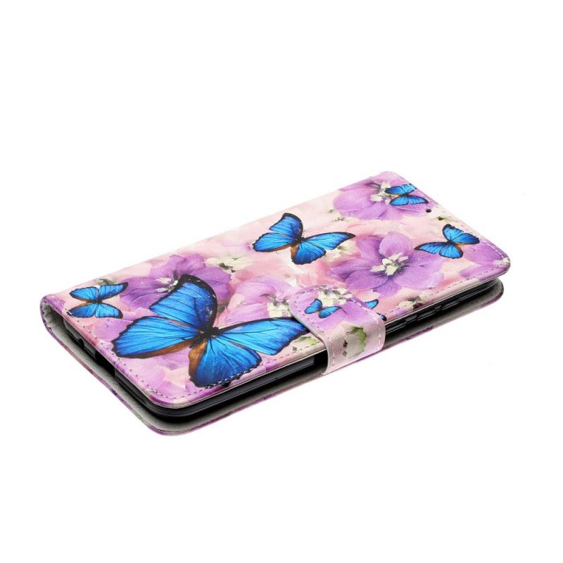 Leren Hoesje voor Huawei Y5p Blauwe Vlinders In De Bloemen