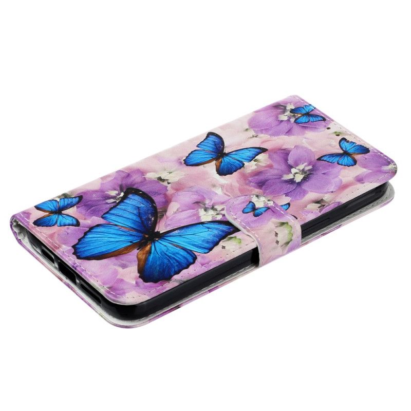 Folio-hoesje iPhone 16 Pro Max Vlinders En Paarse Bloemen Met Riempje