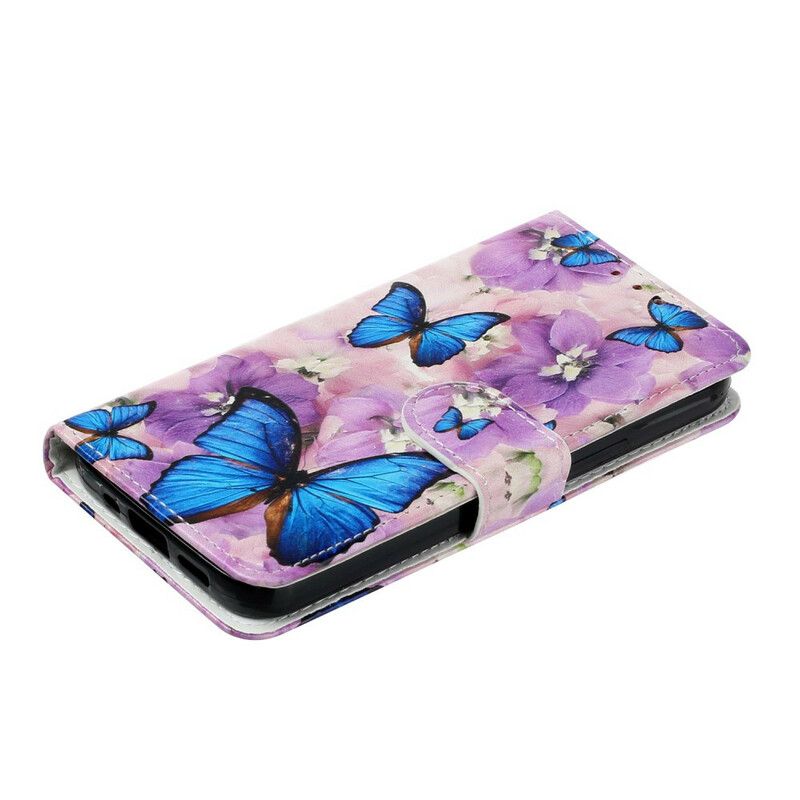 Folio-hoesje iPhone 13 Mini Blauwe Vlinders In De Bloemen