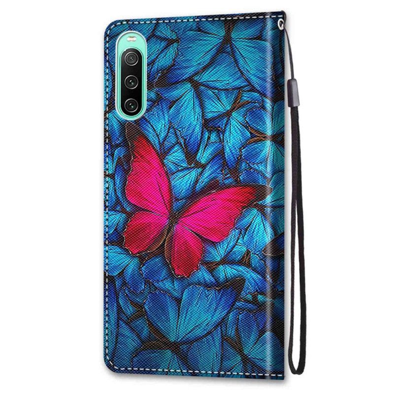 Folio-hoesje voor Sony Xperia 10 IV Rode Vlinder Blauwe Achtergrond